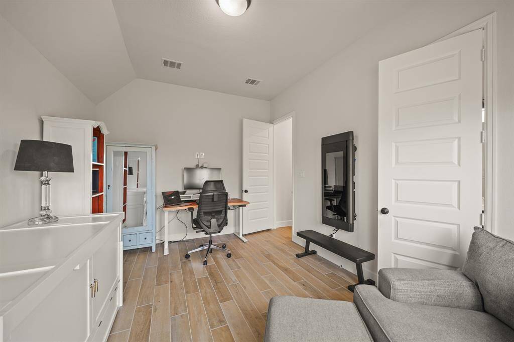Bedroom #2 offers plenty of natural light, a generous closet, & a private bathroom, perfect as a guest retreat.