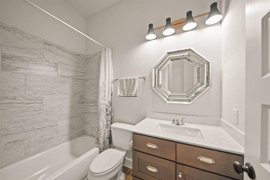 A well-appointed bathroom with updated finishes, perfect for everyday use or accommodating visitors.