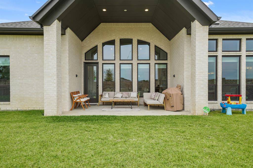 The charming patio, featuring an upgraded "Second Patio Cover Plan Option", offers an ideal space for outdoor dining & relaxation — perfect for enjoying the outdoors in comfort.