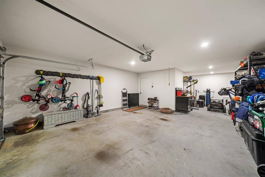 The oversized 3-car garage features a single overhead garage door (in place of two doors), providing plenty of space for cars, tools, & more—perfect for any lifestyle.