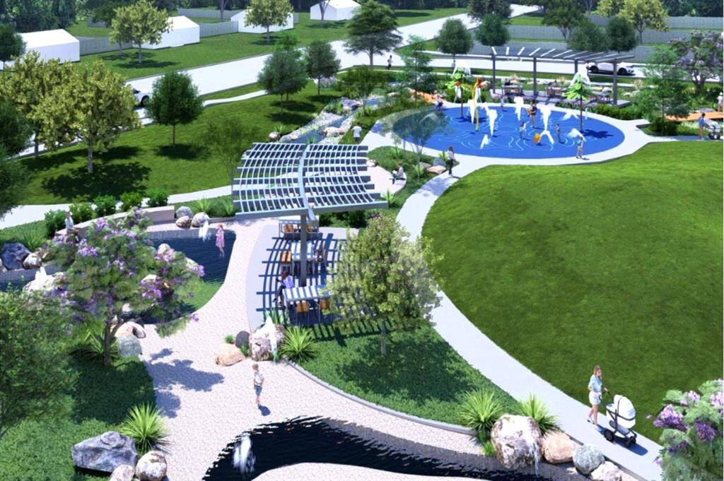 The splash park offers palm-tree spray jets & a safe, soft play surface for kids, while adults relax in the covered seating area with tables — perfect for sunny days of fun & laughter.