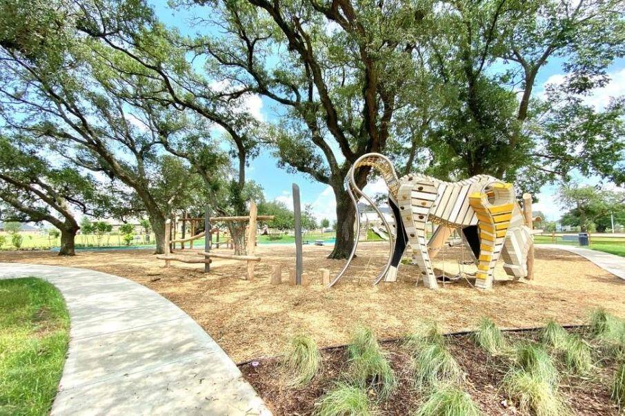 Kids will love this shady park with logs to climb, slides, and a horse-shaped play structure—perfect for a day of fun while you explore homes in Tomball.