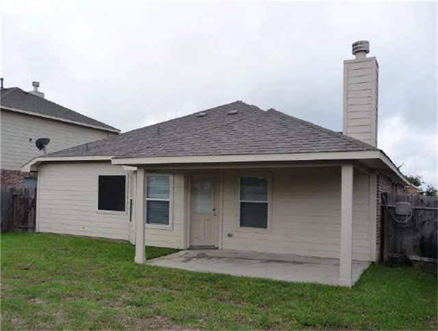 REAR EXTERIOR VIEW FROM BACKYARD
