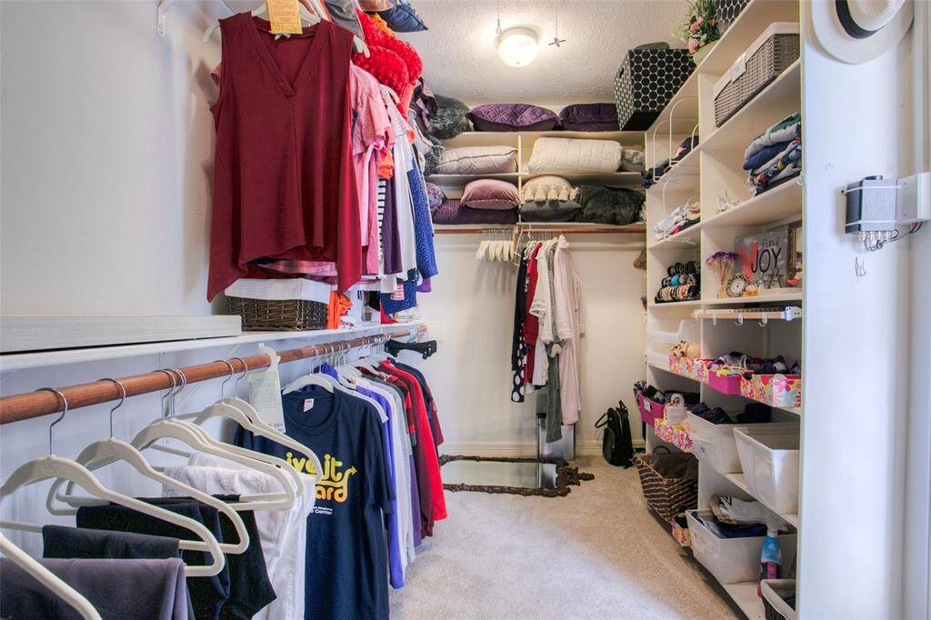 Fantastic primary closet with customized shelving and some extras!