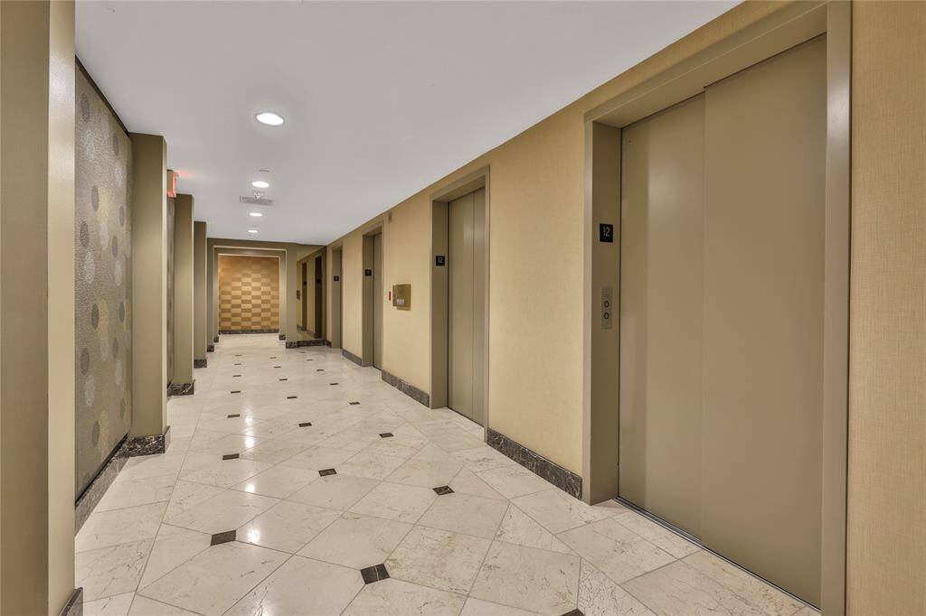 The building elevators are easily accessible from the home.