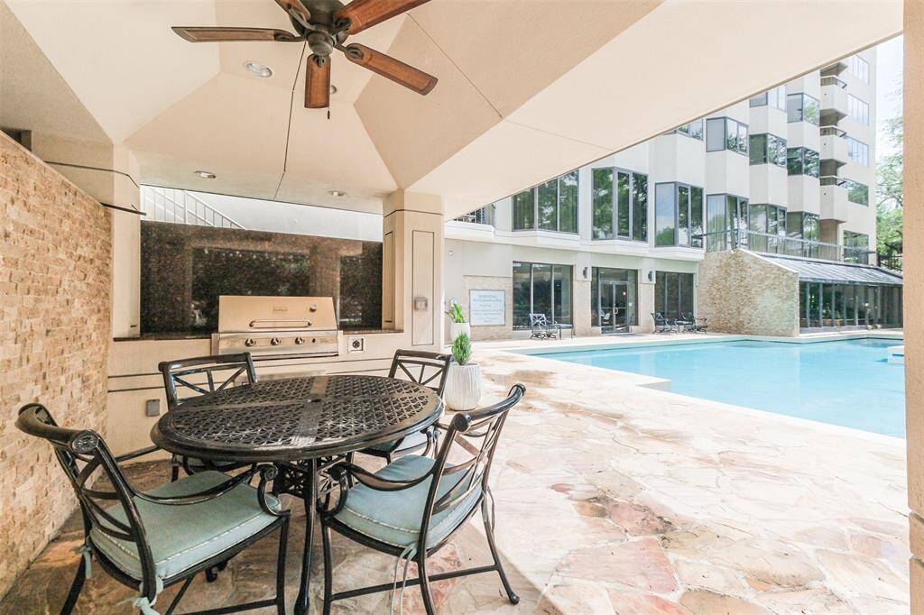 This covered area off of the community pool is a great place to grill and have dinner poolside.
