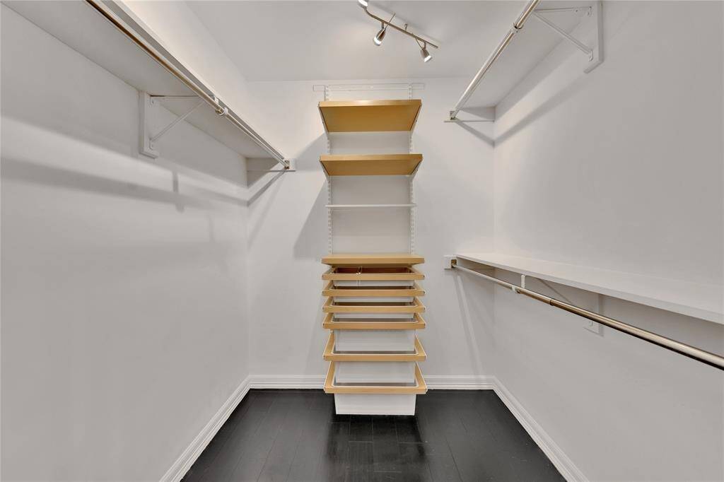 The primary closet has plenty of hanging space and shelving to keep your wardrobe organized.