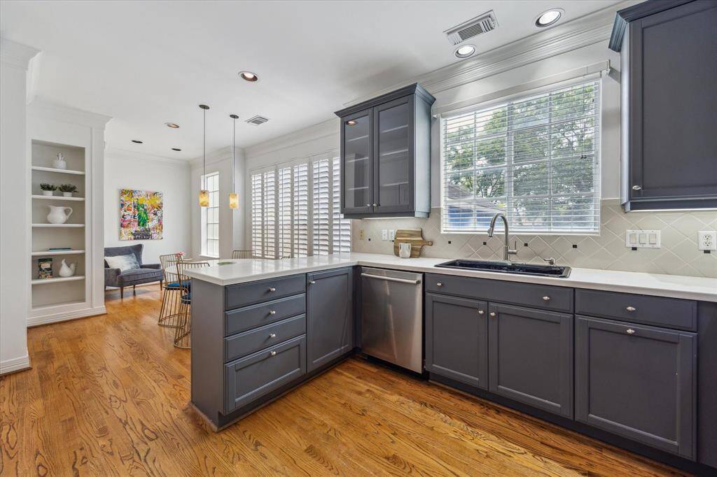 The updated kitchen features a cozy sitting area, ideal for morning coffee or casual dining.