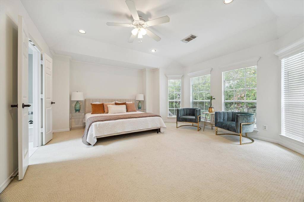 Retreat to the luxurious primary suite, complete with a separate sitting area, a generous walk-in closet, and a spa-inspired bathroom that invites relaxation.