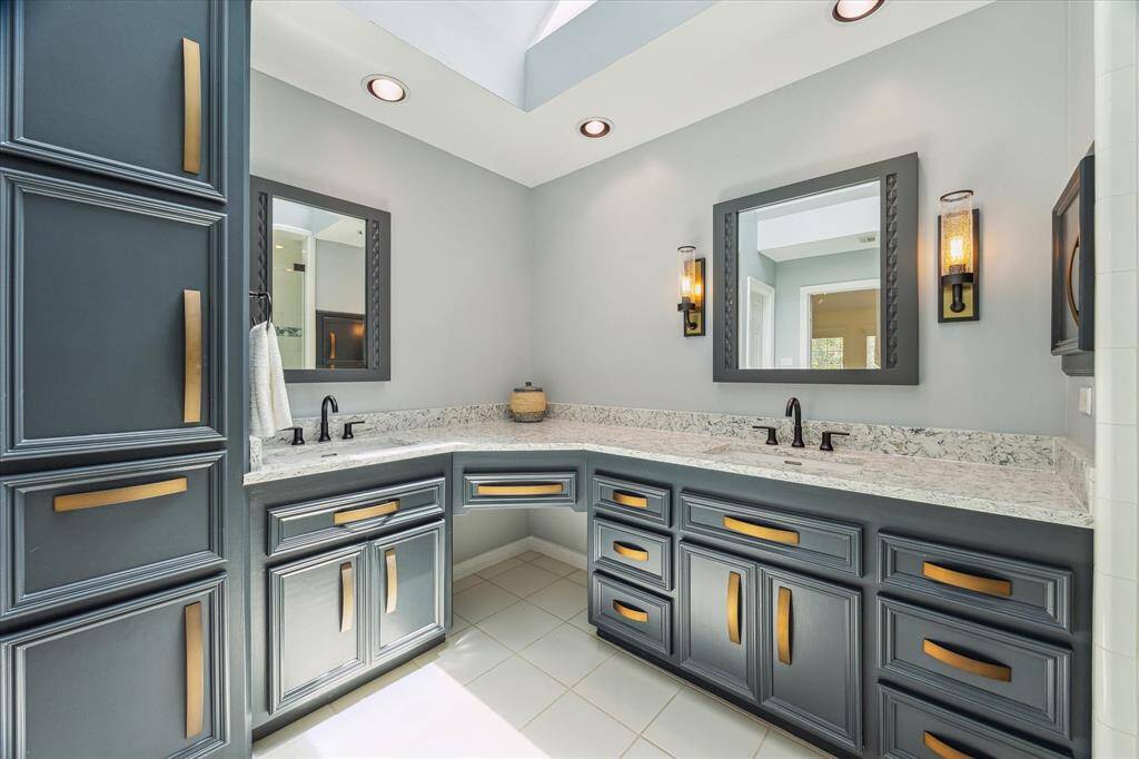 The layout is both elegant and functional, offering plenty of counter and storage space.