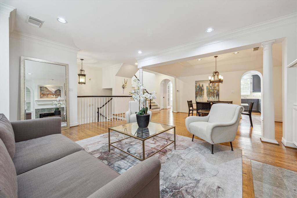 The open-concept layout offers sightlines from the living room through to the dining area and into the kitchen.