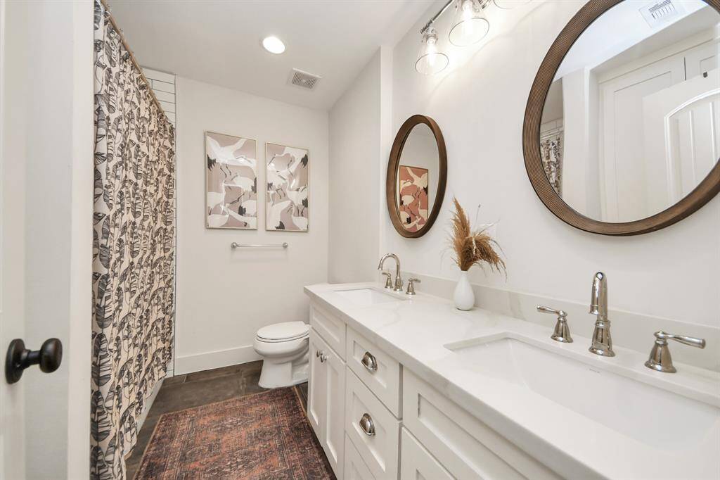 Conveniently located bathroom adjacent to two guest bedrooms.