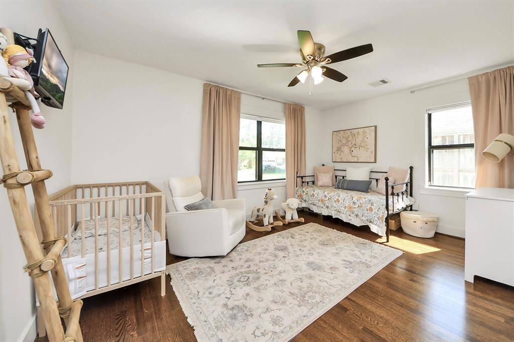 Front guest bedroom with hardwood floors and ample closet space, 2 windows for tons of natural light. There are blackout shades in both of the secondary bedrooms