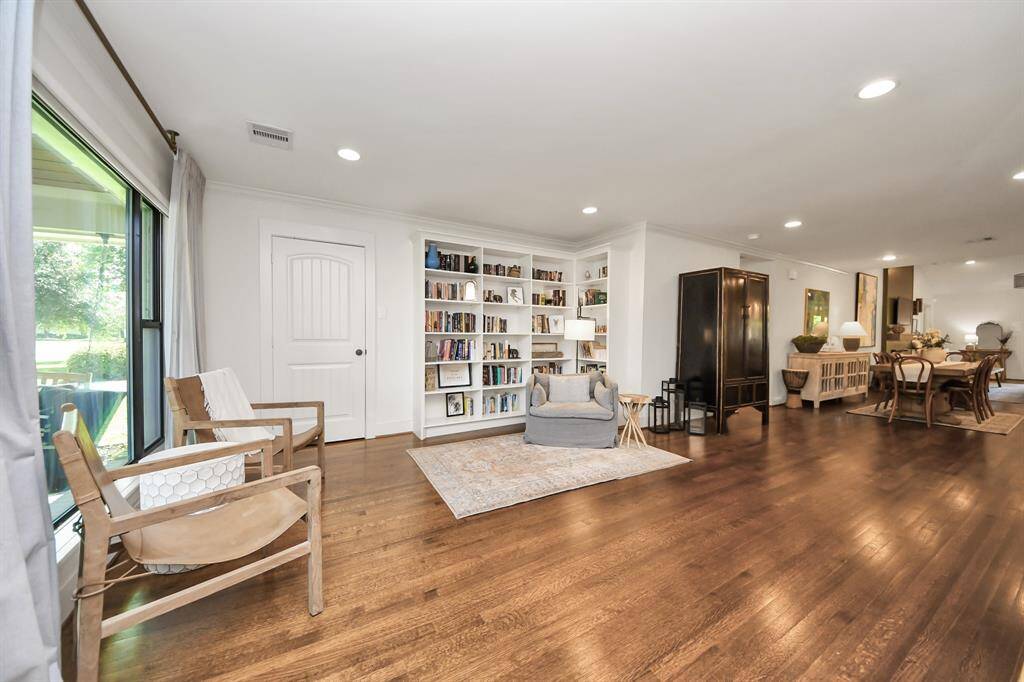 Wide open entertaining space with beautiful hardwood floors and large picture window at the front of the home.  Generous entry closet as well as storage closet as you go into the secondary bedroom area.