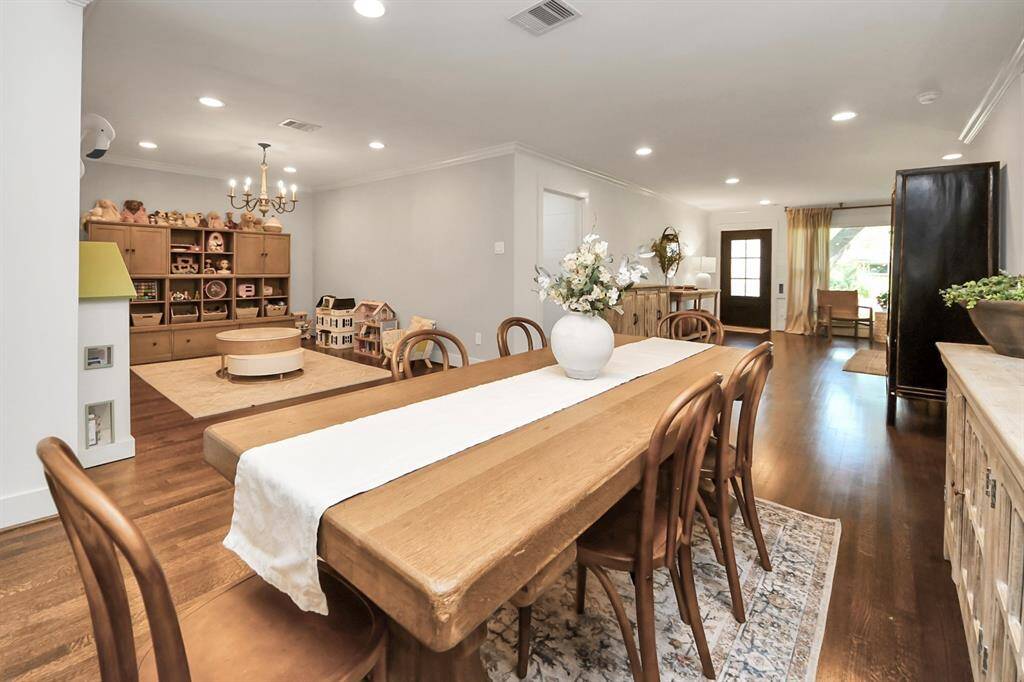 This versatile space is perfect for dining, an office nook, or a bar area. Currently, the dining room is creatively used as a children's play area, tucked away from the main living space but just in eyesight!