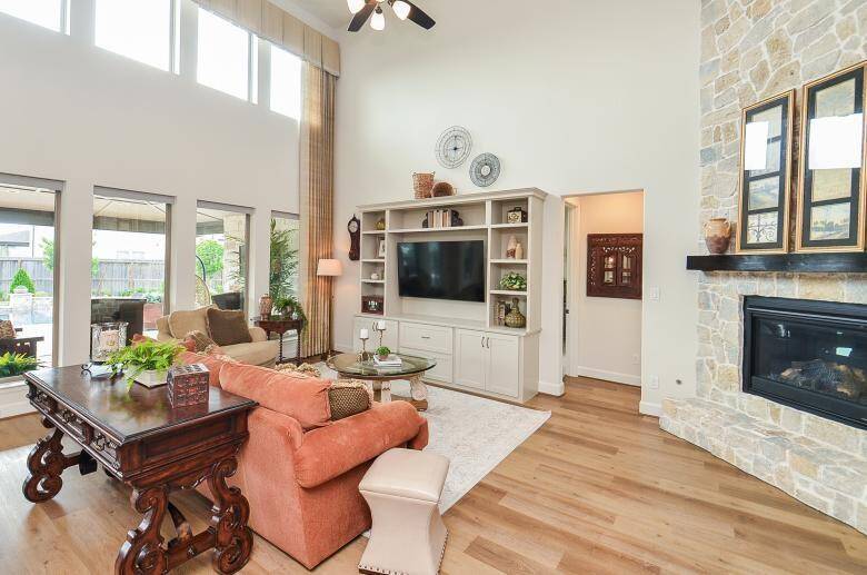 Family Room Features an Abundance of Natural Lighting and a Custom Built-in Shelving.