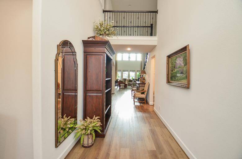 Inside Where You will be Greeted by Soaring Open 2-Story Ceiling and Wood Look Vinyl Flooring.
