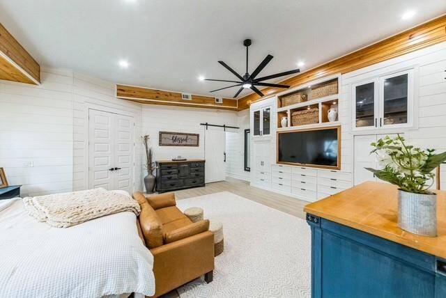 Barn door leads to hallway, doors on left lead to the spa-like bath