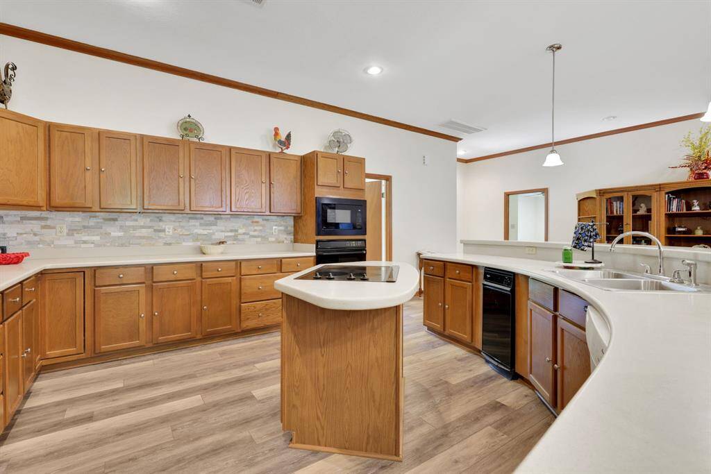 The island kitchen has tons of cabinet space for storage