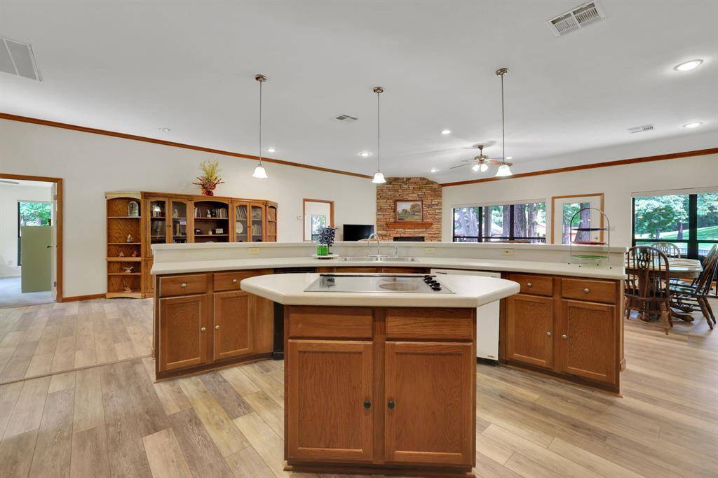 Two kitchen islands - one with the cooktop and the other with sink and breakfast bar