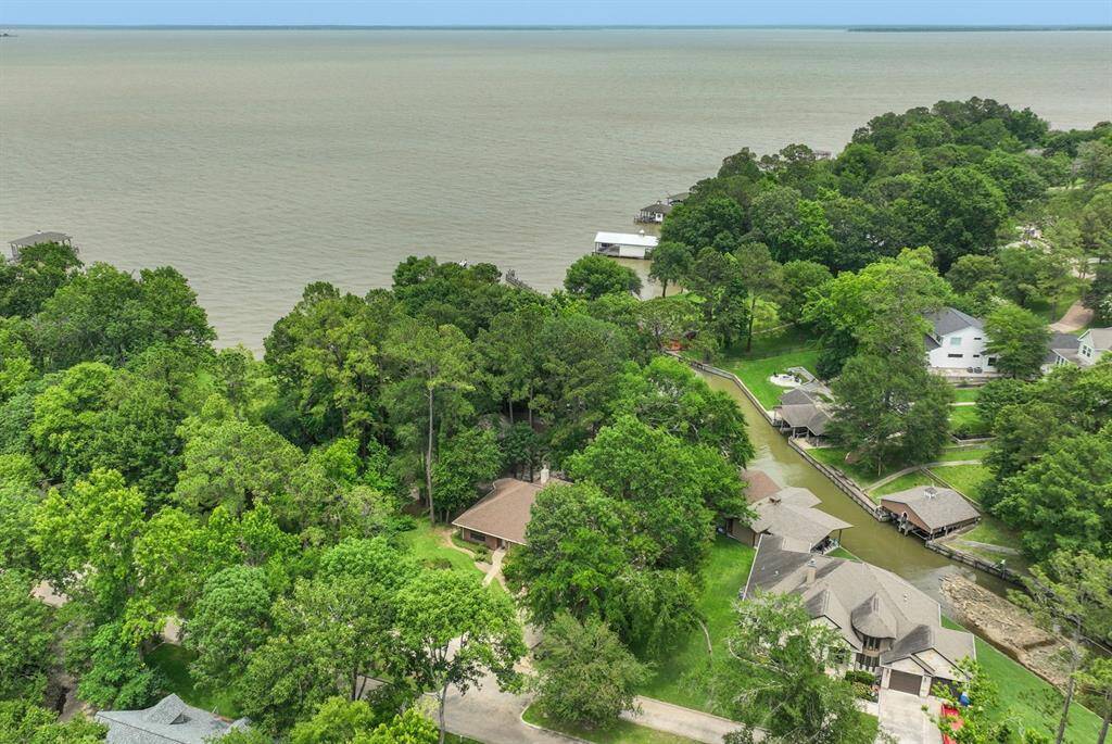 This waterfront home is located on the Lake Oaks Landing harbor