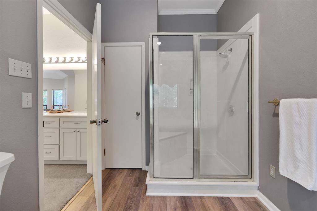 The primary bathroom has a separate shower and tub