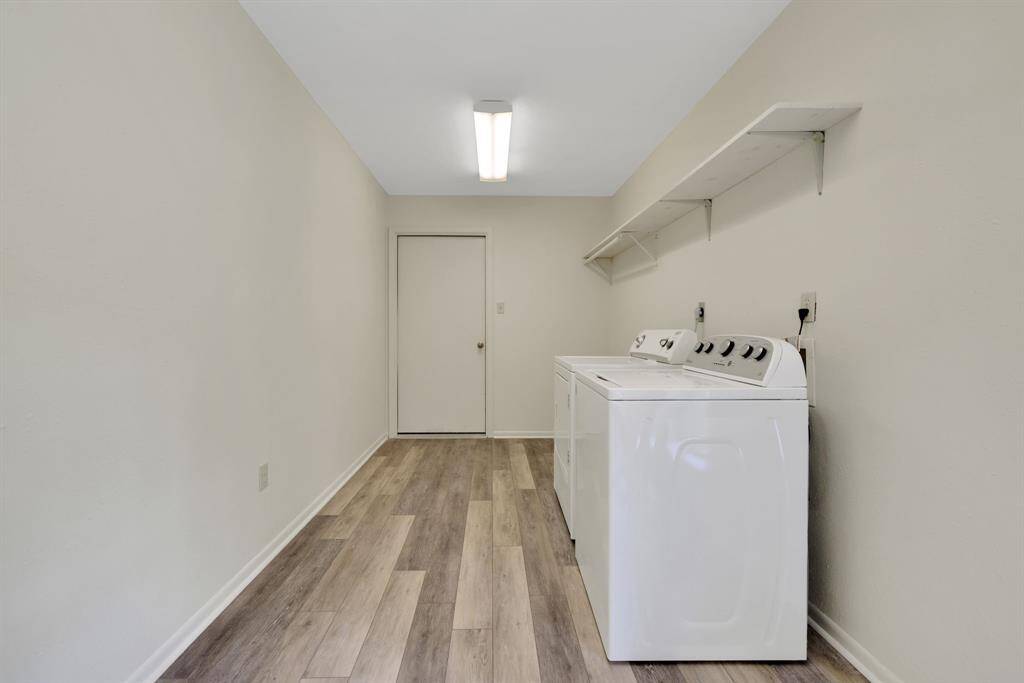 The laundry room is off the kitchen and leads through to the attached garage
