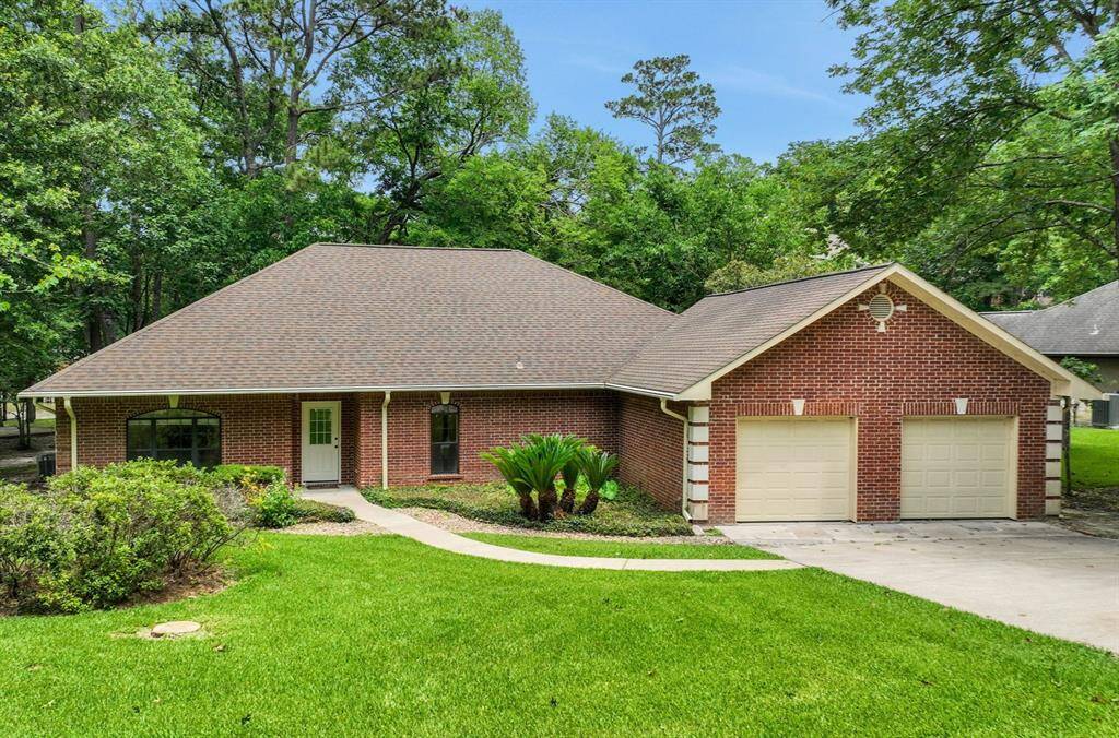 This one story brick home has an attached, oversized, two car garage