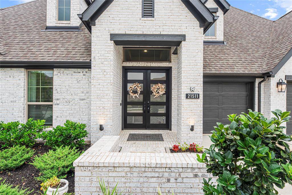 Gorgeous double doors for a grand entrance into this immaculate home!