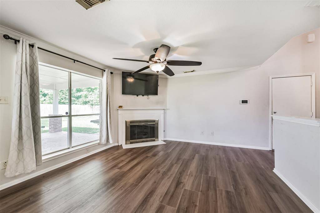 Large picture window overlooking the backyard bring the outside- in, to this home.