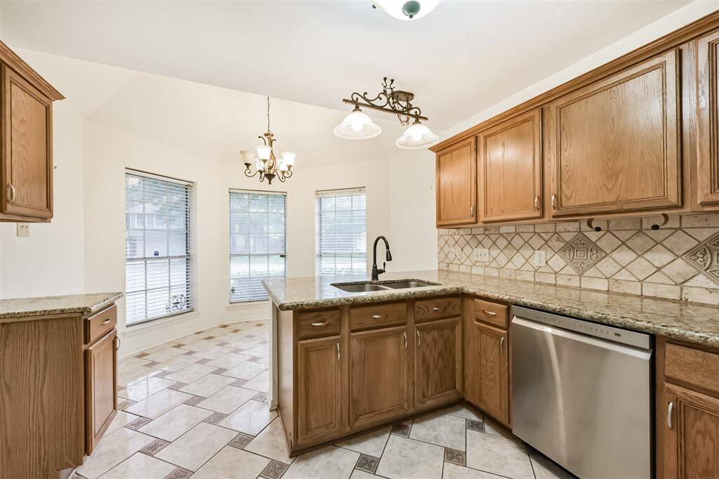Natural light fills the space, highlighting every detail of this inviting kitchen.