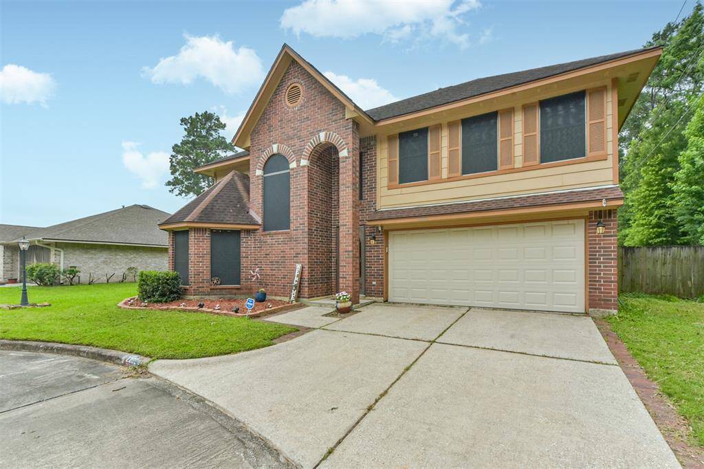 Beautiful brickwork, mature landscaping, and a peaceful, no-thru-traffic street set the tone.