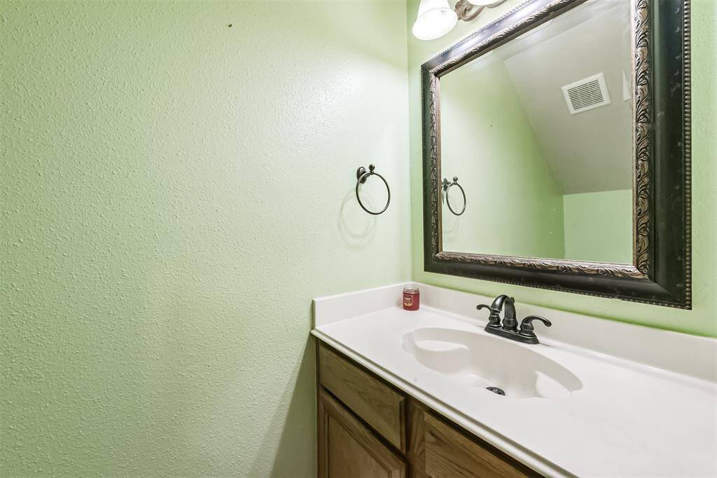 Half bathroom downstairs conveniently located for guests to use.