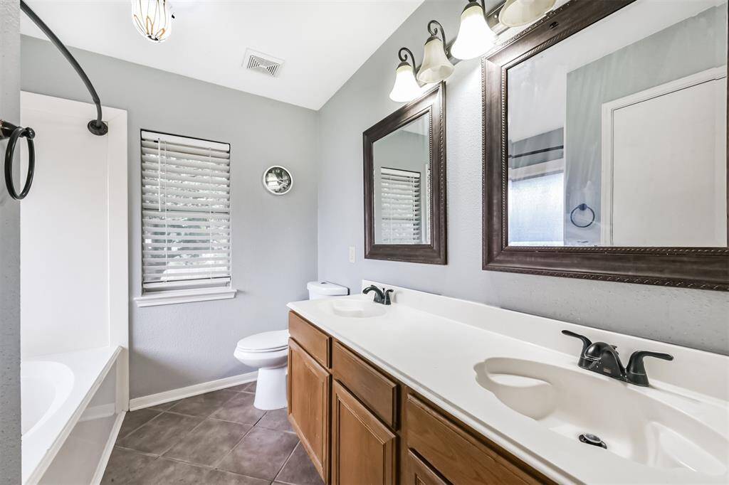 Featuring dual sinks, a shower/tub combo, and plenty of counter space.