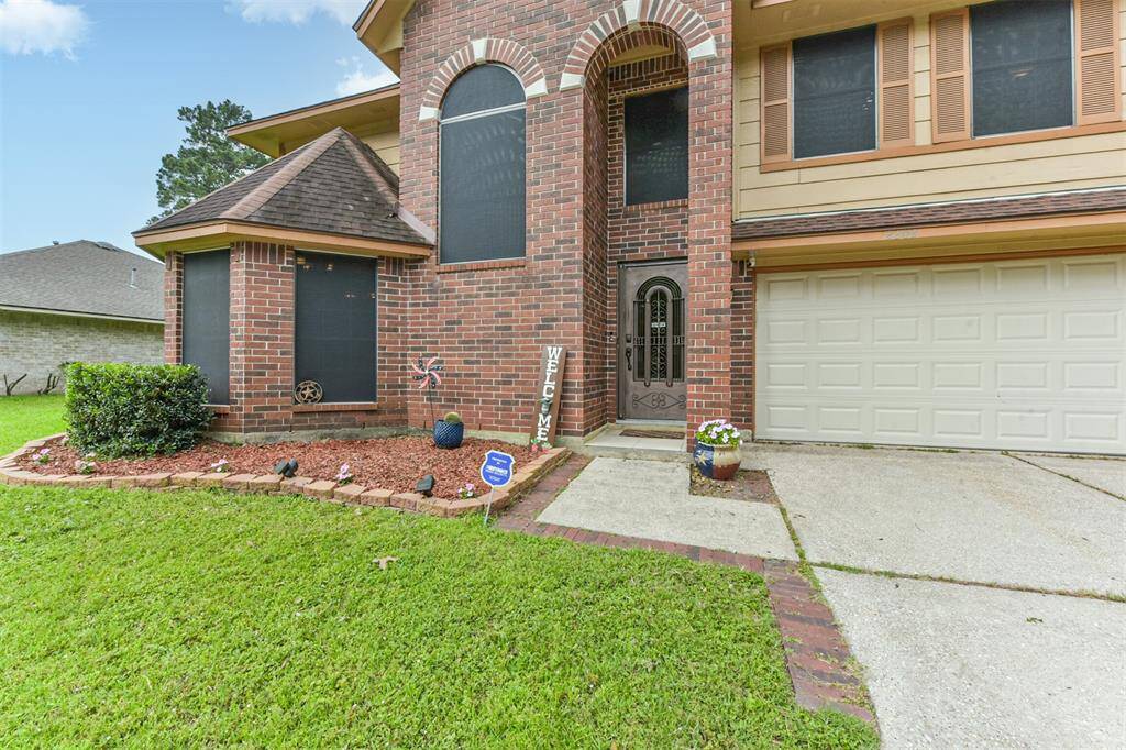 The covered front entrance offers both style and shelter, perfect for greeting guests.