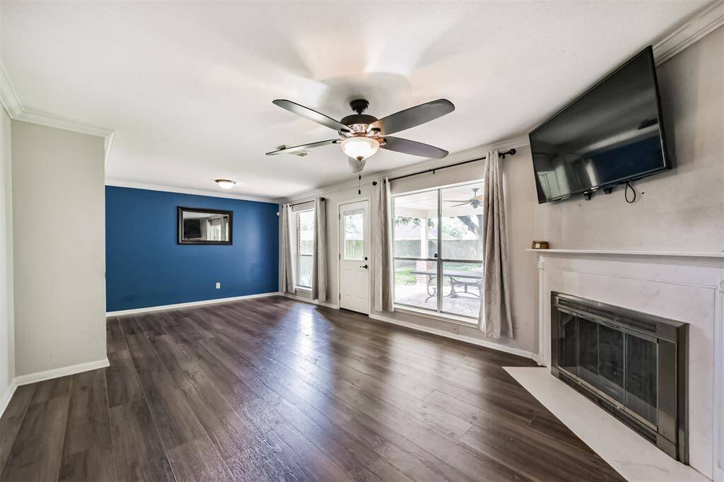 Gather around the gas fireplace, accented by neutral tones and soft lighting.