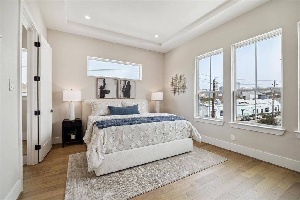The primary bedroom is spacious with engineered wood floors through out the entire home.