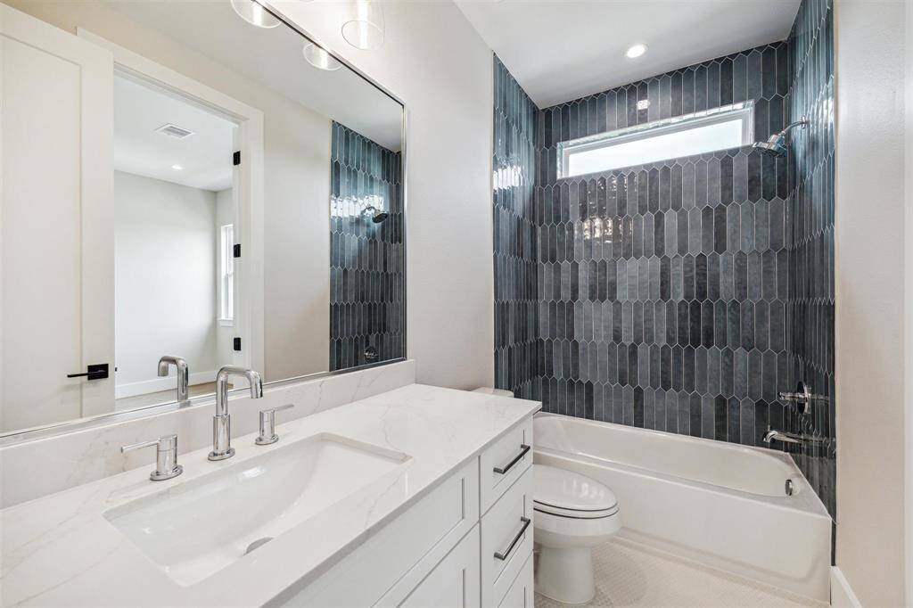 Guest bedroom located down the hallway from primary. Large enough for a kind bed set and more!