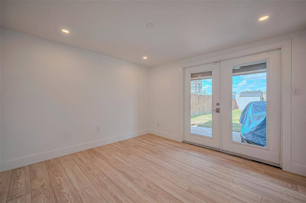 Enjoy meals in the formal dining room, featuring a window that looks out to the backyard, bringing a touch of nature indoors.