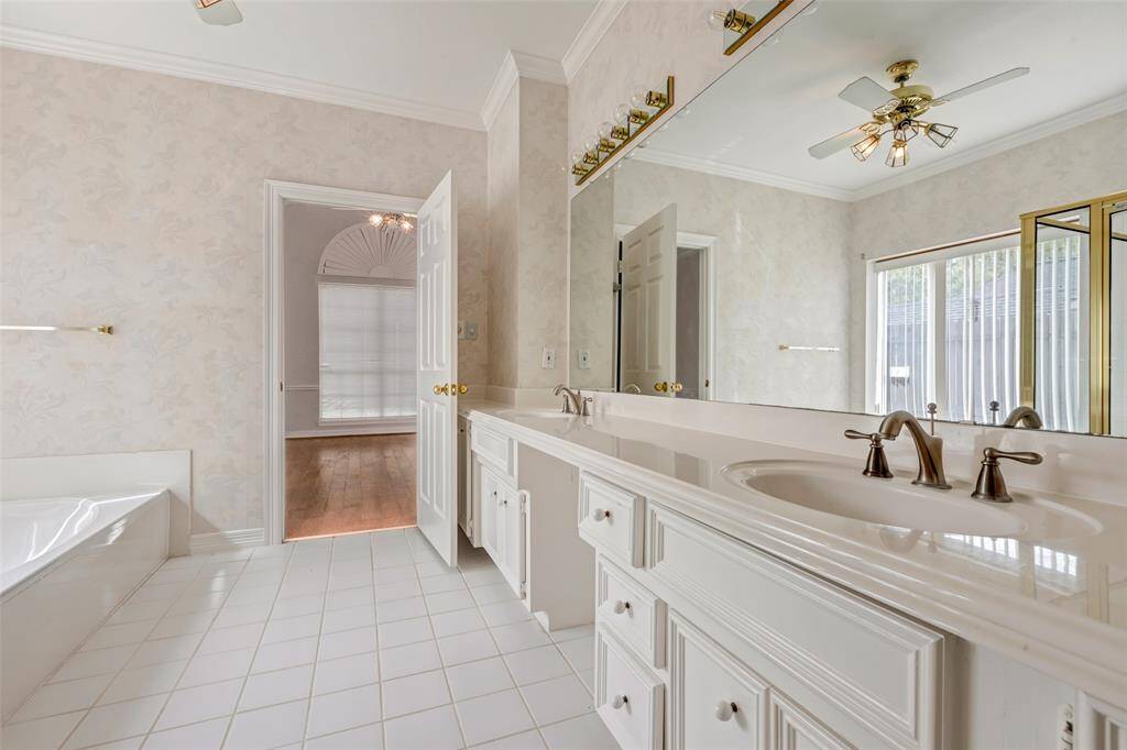 The double sink vanity allows for two to get out the door in no time. The vanity space allows for a chair so you can apply make-up or style your hair in comfort.