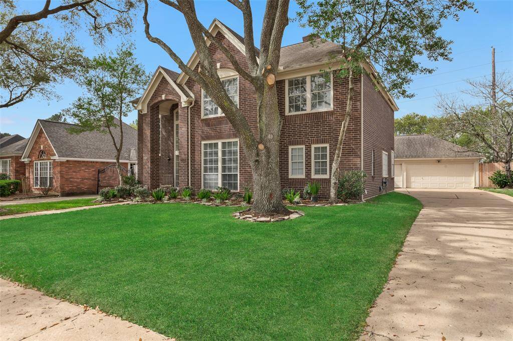 With just over 3,000 square feet, this brick home features established trees providing a canopy of shade over the front lawn and fresh landscaping. The long driveway leads to a detached 3-car garage.