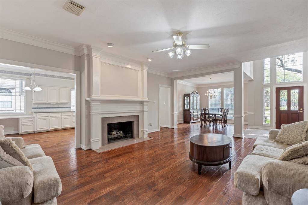 Sight lines from the family room point to the front entry, dining room and kitchen. Fresh paint makes this space crisp and clean.