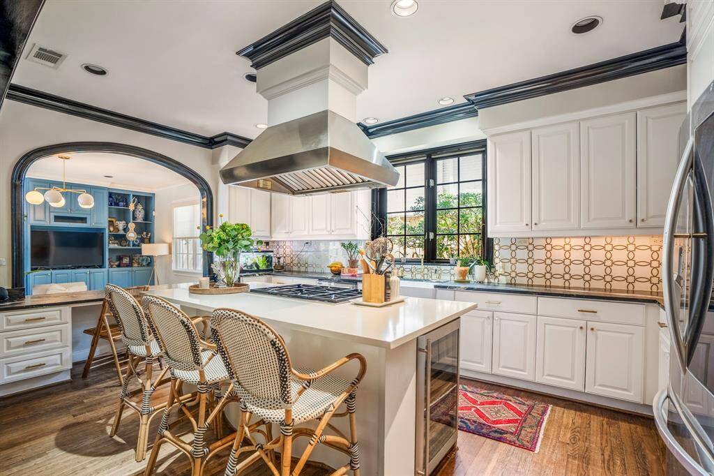 Gather around the oversized island—this kitchen is made for connection, creativity, and culinary magic.