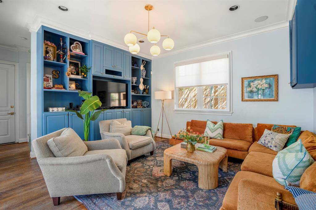 Built-in shelving and warm natural light create the ultimate gathering space.