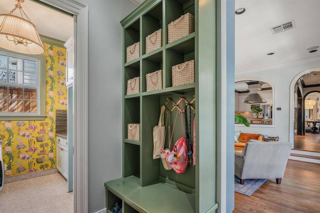 A beautifully designed mudroom that keeps everyday life organized with effortless style, conveniently positioned off the garage entry. The ultimate drop zone—practical yet polished, with custom storage and designer touches.