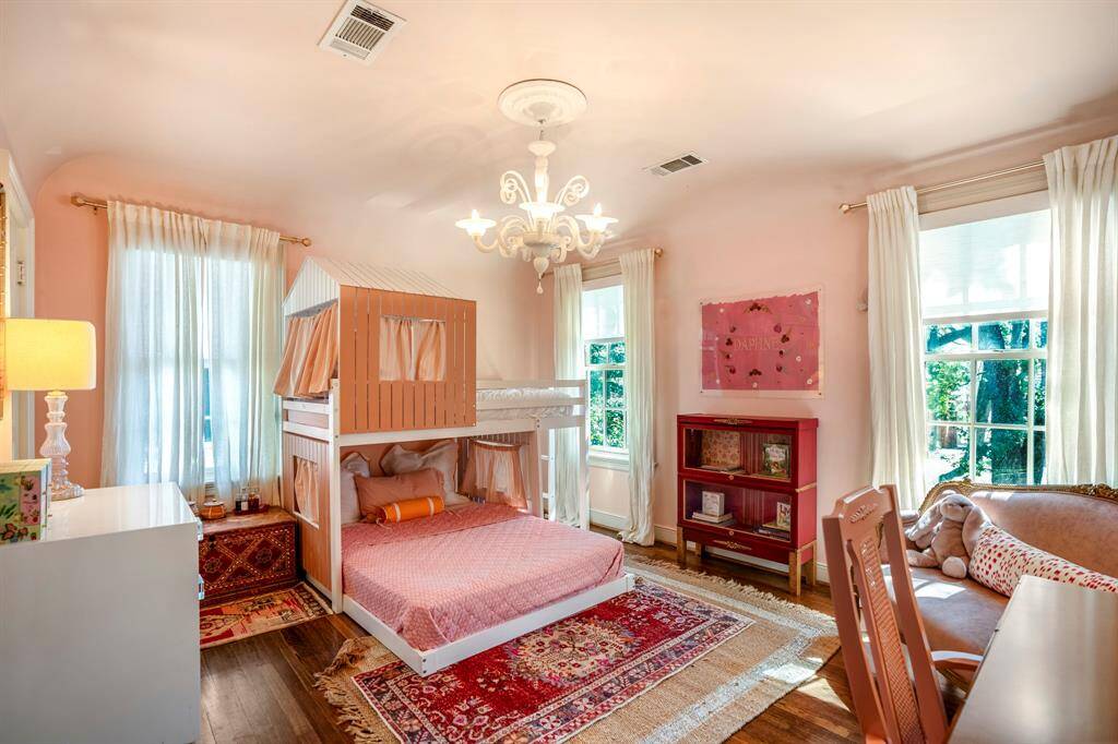 Secondary bedrooms offer generous space and charm, perfect for family or guests.