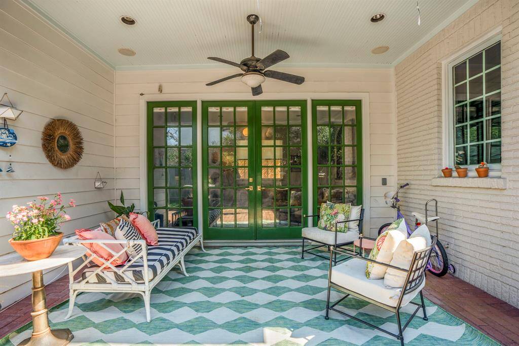 Step outside through classic French doors to a backyard that feels like a European escape. This covered patio is an entertainer’s dream—spacious, stylish, and designed for year-round enjoyment.