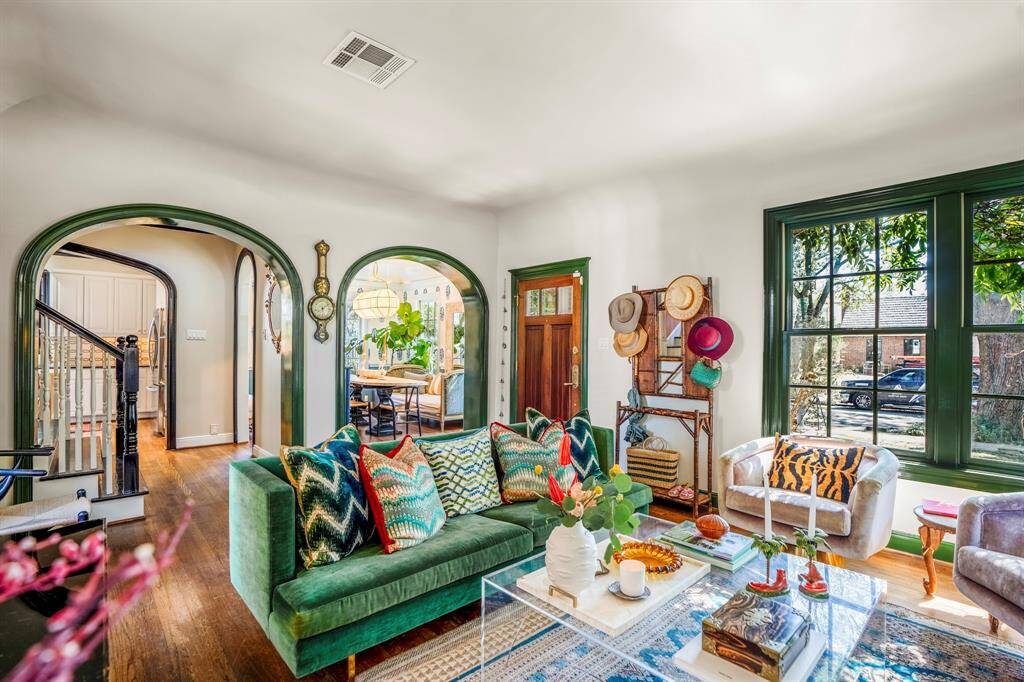 Beyond the elegant entry, graceful lacquer-cased archways lead to the formal living and dining rooms, which sit side by side