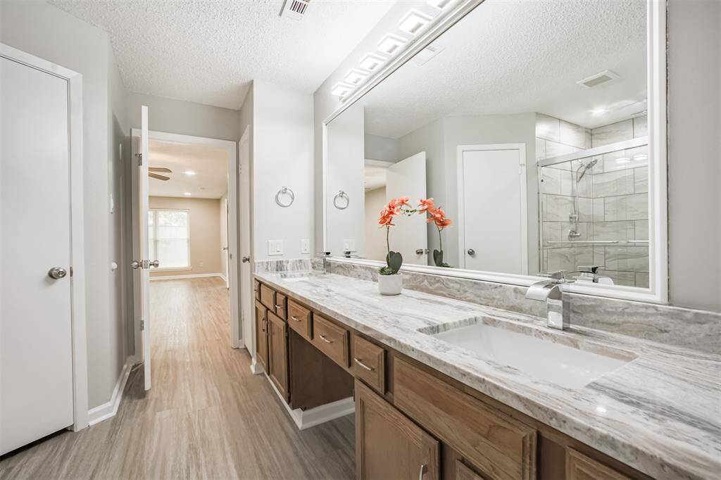 The updates in the primary bath leave a spa like feel.