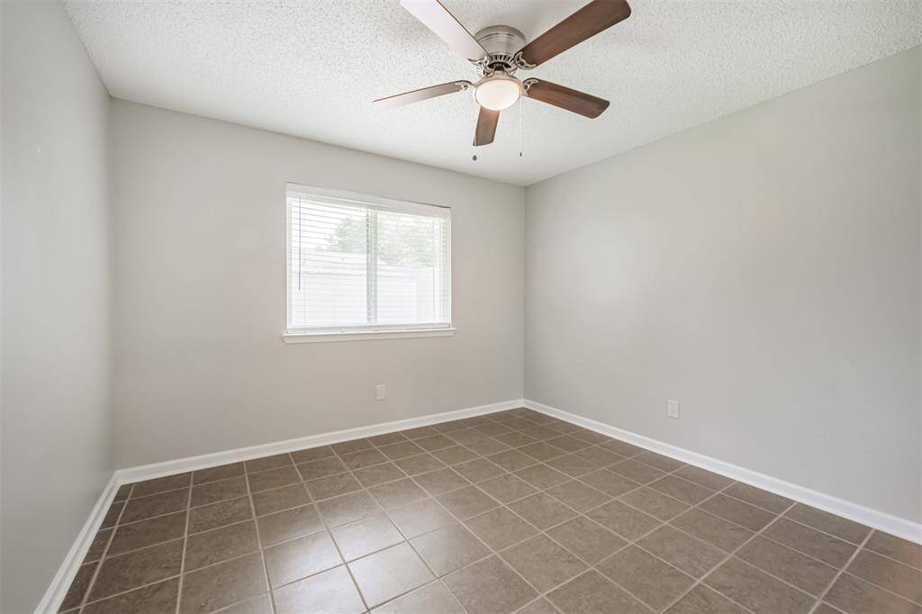 Third bedroom at the back of the home. Updated ceiling fan!
